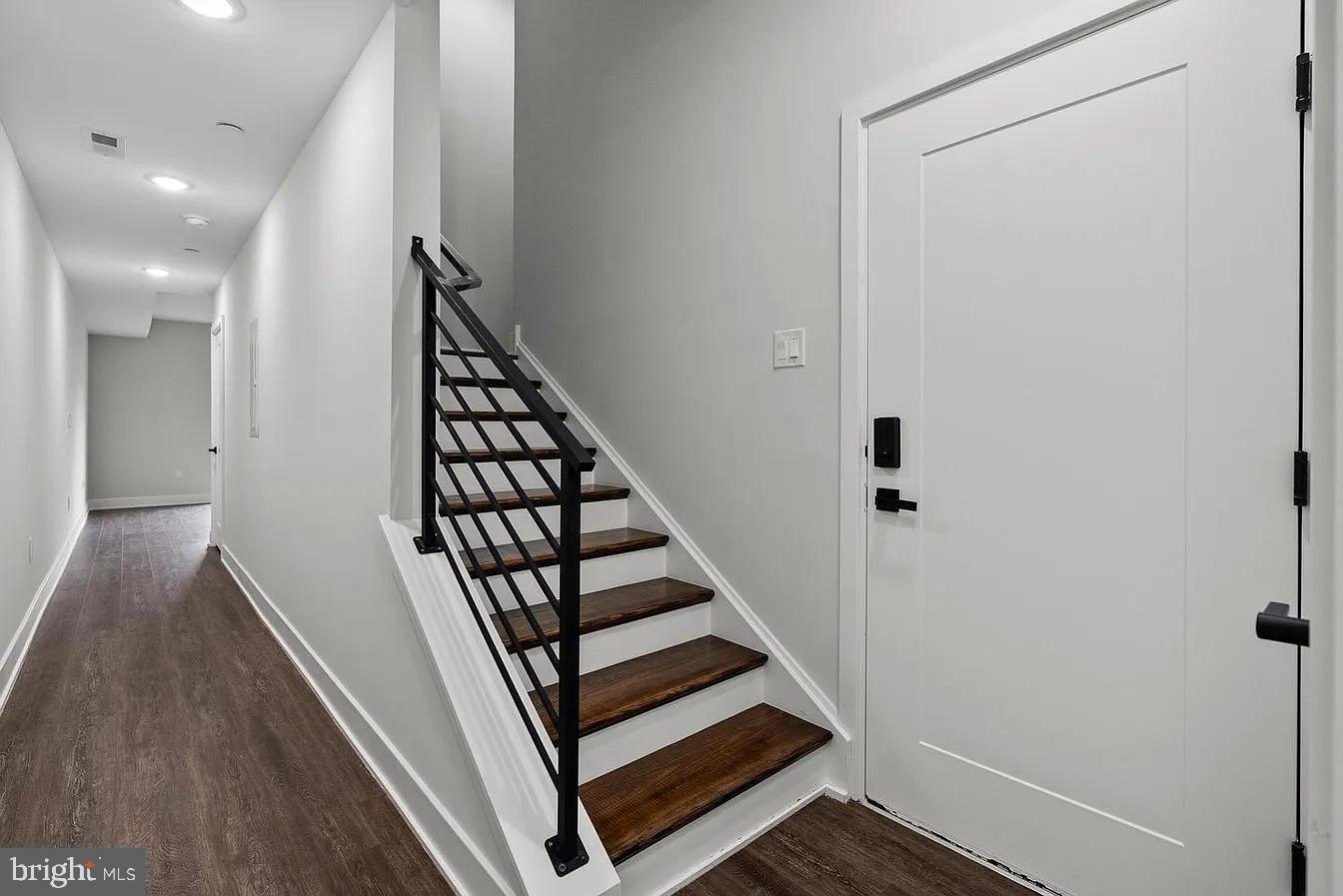 2146 North Front Street, Unit 3 Philadelphia, PA 19122 - Photo 13 of 23 a view of a hallway with wooden floor and staircase