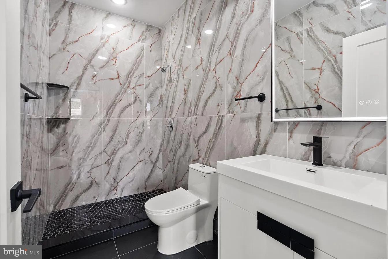 2146 North Front Street, Unit 3 Philadelphia, PA 19122 - Photo 2 of 23 a bathroom with a sink toilet and shower