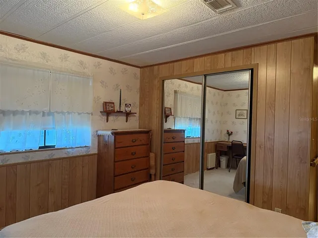 a living room with furniture and flat screen tv