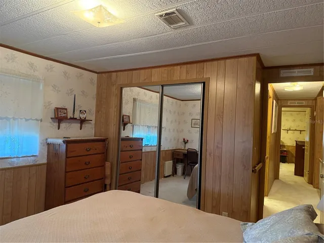 a view of a room with furniture and a window