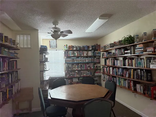 a view of outdoor space with signage and flags