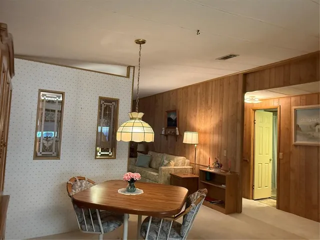 a view of a dining room with furniture