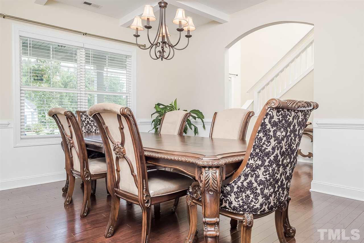 4436 Glengrove Road Raleigh, NC 27616 - Photo 11 of 25 a view of a dining room with furniture window and wooden floor