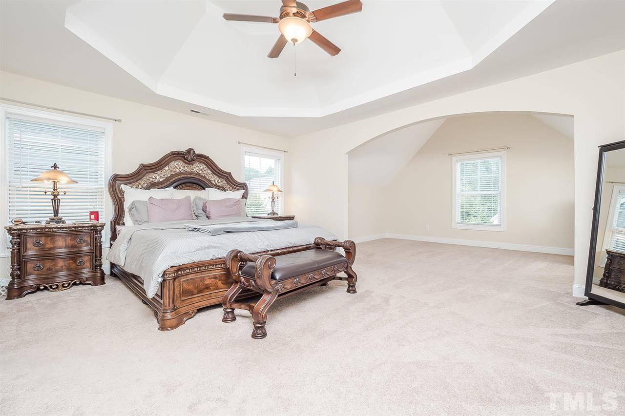 4436 Glengrove Road Raleigh, NC 27616 - Photo 14 of 25 a living room with a bed furniture and a window