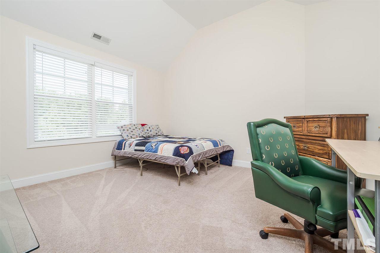 4436 Glengrove Road Raleigh, NC 27616 - Photo 20 of 25 a living room with furniture and a window