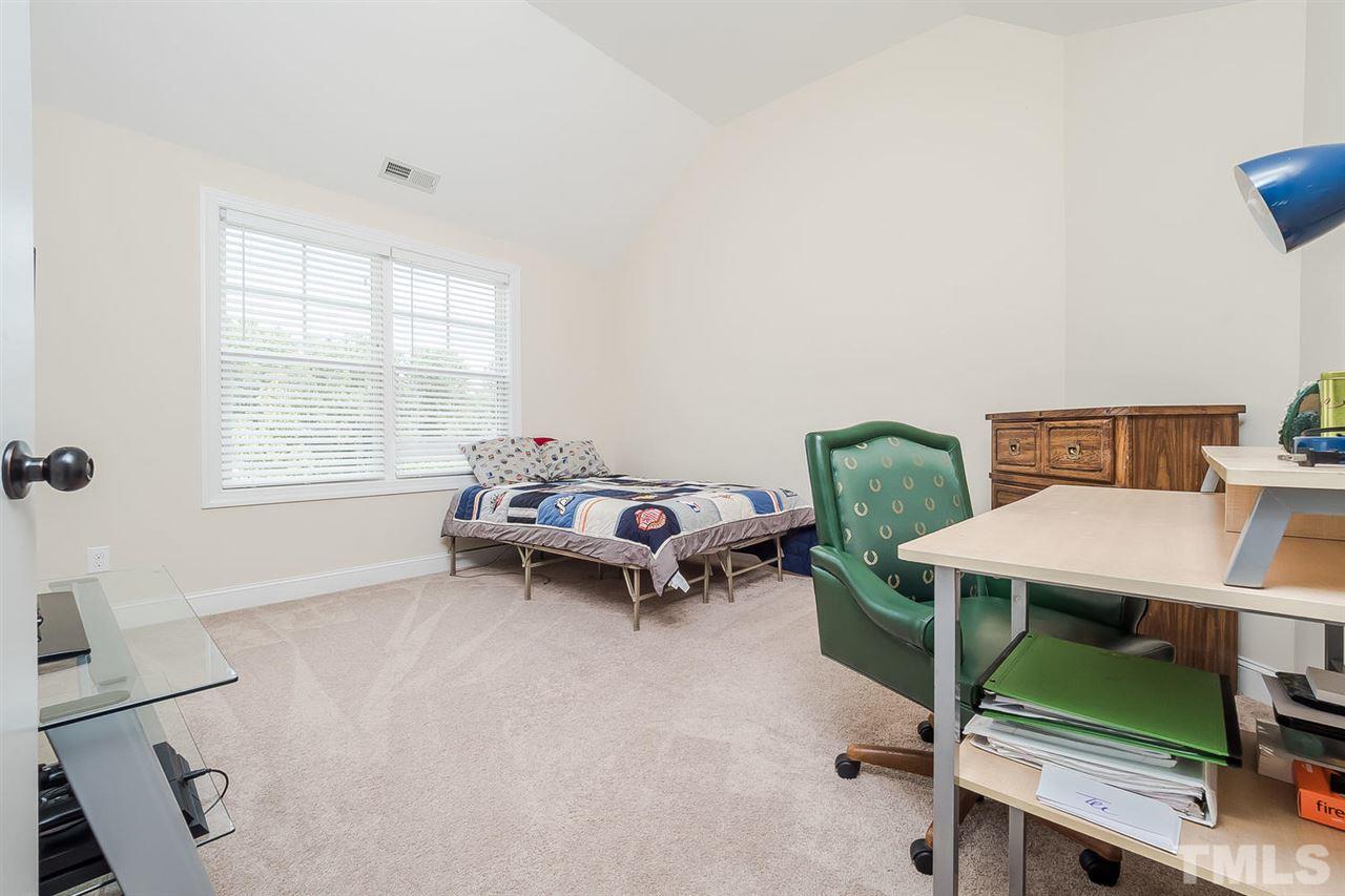 4436 Glengrove Road Raleigh, NC 27616 - Photo 21 of 25 a living room with furniture and a window