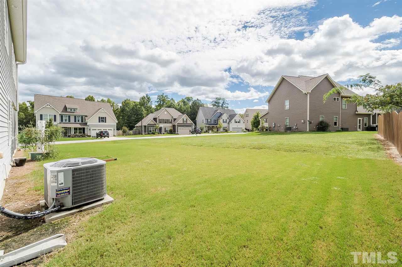 4436 Glengrove Road Raleigh, NC 27616 - Photo 24 of 25 a view of a house with a yard and sitting area