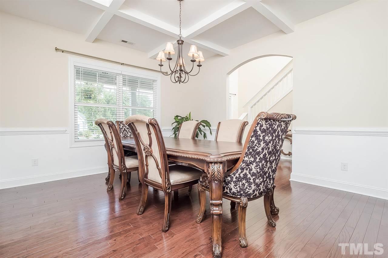 4436 Glengrove Road Raleigh, NC 27616 - Photo 10 of 25 a view of a dining room with furniture window and wooden floor