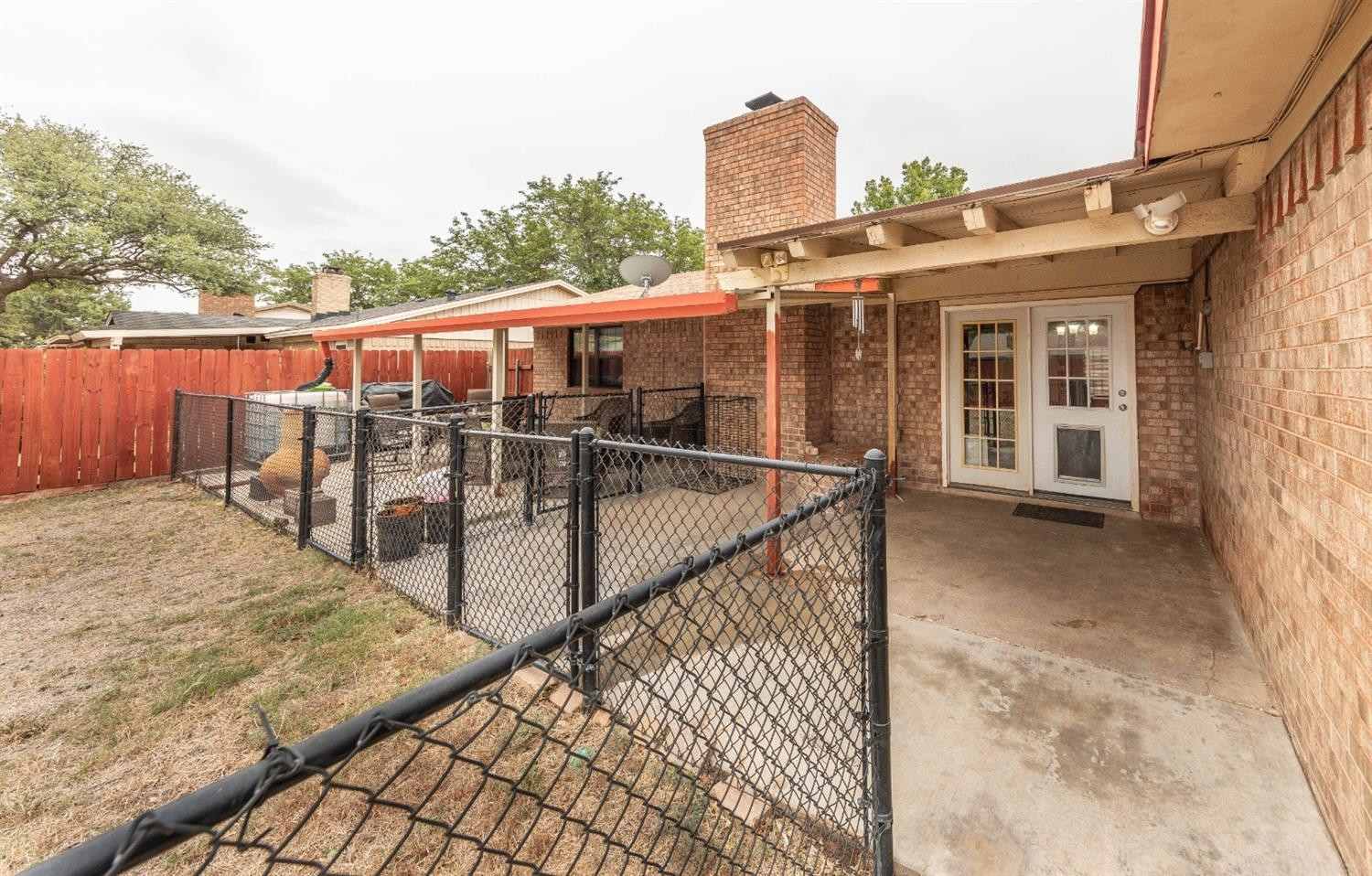 5722 2nd Place Lubbock, TX 79416 - Photo 16 of 21 a view of a house with a wooden fence