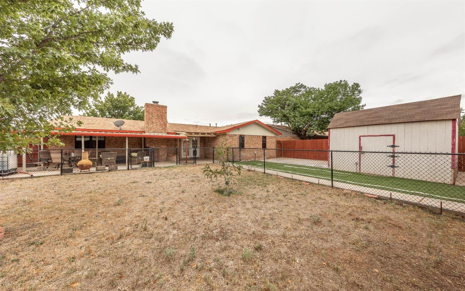 5722 2nd Place Lubbock, TX 79416 - Photo 18 of 21 a house with trees in the background