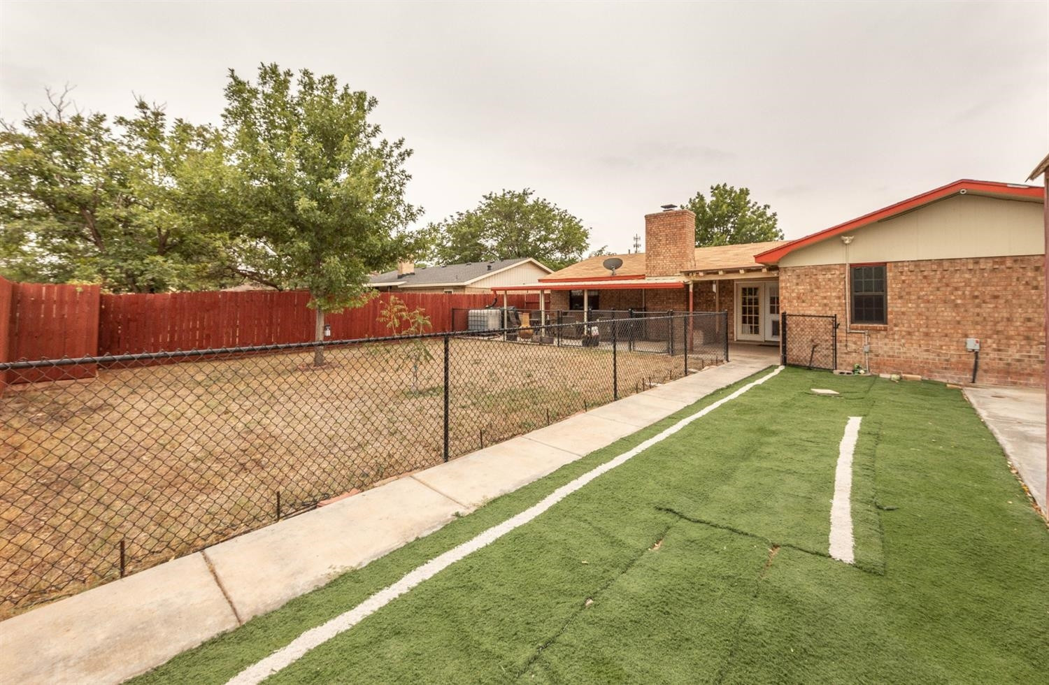5722 2nd Place Lubbock, TX 79416 - Photo 20 of 21 a view of a house with backyard and sitting area