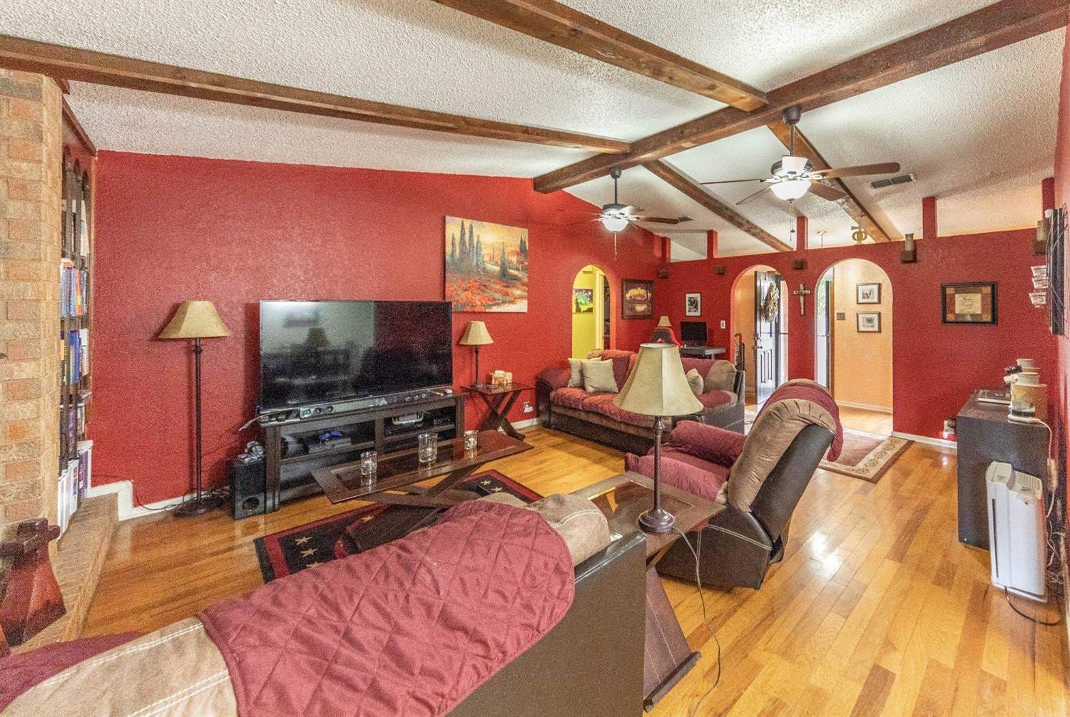 5722 2nd Place Lubbock, TX 79416 - Photo 2 of 21 a bedroom with furniture and a flat screen tv