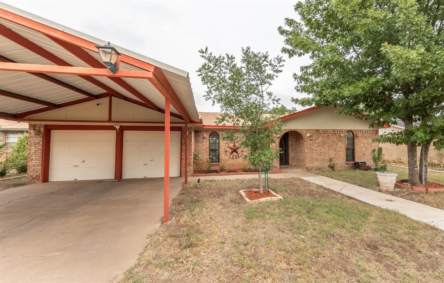 5722 2nd Place Lubbock, TX 79416 - Photo 21 of 21 a view of a house with a yard and tree