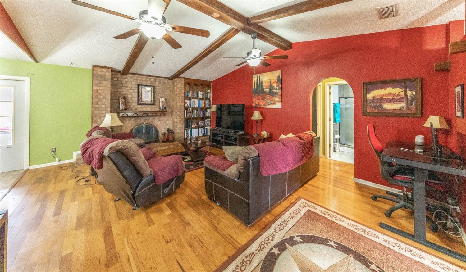 5722 2nd Place Lubbock, TX 79416 - Photo 4 of 21 a living room with furniture a flat screen tv and a table