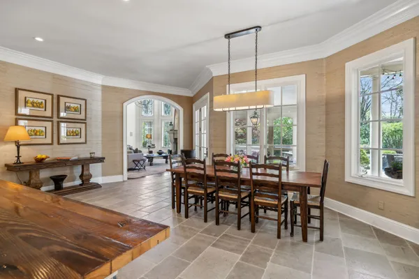 a kitchen with stainless steel appliances granite countertop a sink a stove and a refrigerator