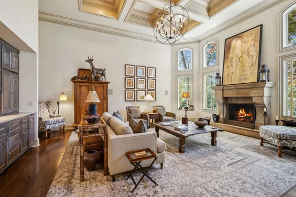 a room with lots of furniture and a wooden floor
