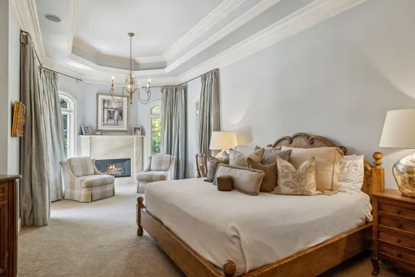 a bedroom with furniture and a window