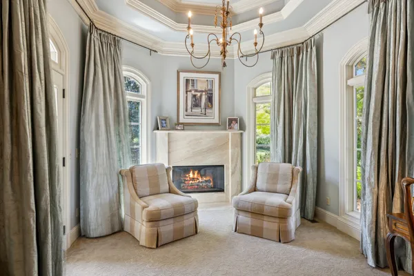 a spacious bedroom with a bed and a couch