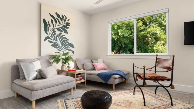 a living room with furniture and a large window