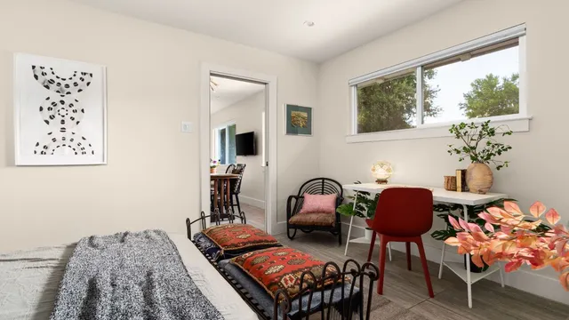 a living room with furniture and a potted plant