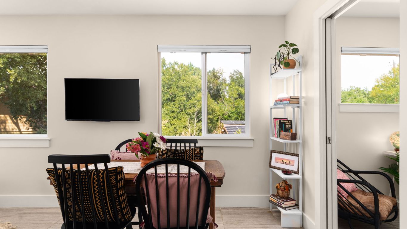 1208 Enfield Road, Unit 204 Austin, TX 78703 - Photo 10 of 21 a living room with furniture and a flat screen tv