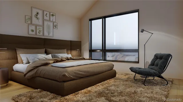 a bedroom with a bed and a couch