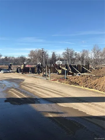 a view of ocean with a building in the background
