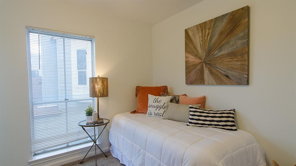2529 Rio Grande Street, Unit 39 Austin, TX 78705 - Photo 11 of 21 Natural light streams through a large window onto soft carpeting in this cozy bedroom.