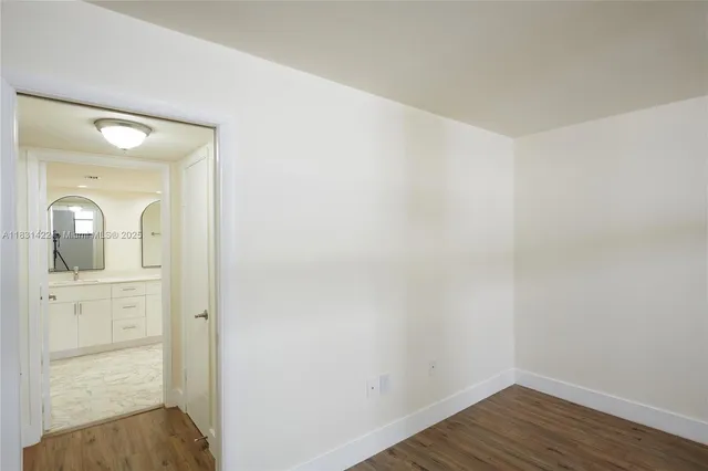 a view of a bathroom from a hallway