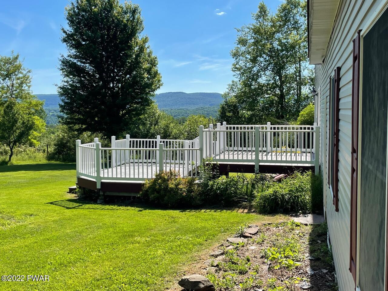 524 Creamton Drive Prompton, PA 18456 - Photo 7 of 57 a view of a deck with a fence