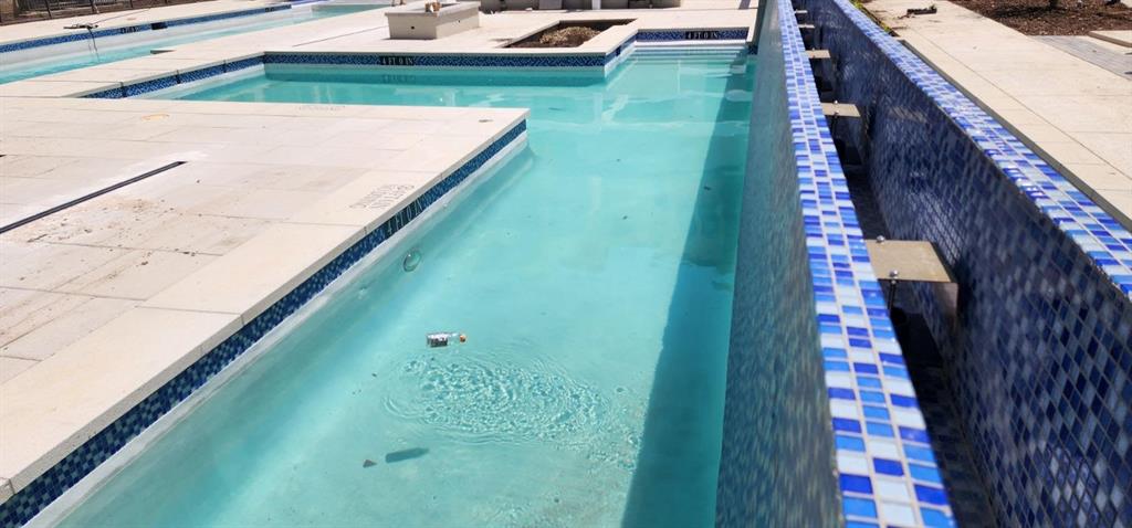 2700 Old Denton Road, Unit 4440 Carrollton, TX 75007 - Photo 12 of 16 a view of swimming pool from a balcony