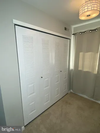 a bathroom with a shower and a sink