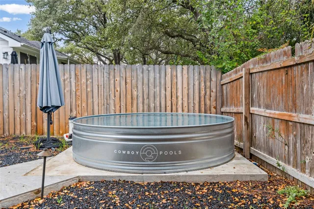 a large tree in front of a house