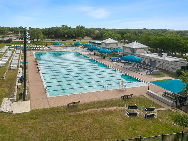 an aerial view of a house with a swimming pool