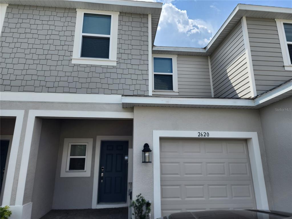 2620 Penguin Boulevard Davenport, FL 33837 - Photo 1 of 14 a view of a house with many windows