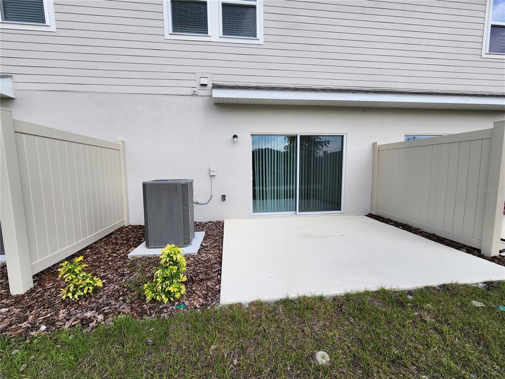 2620 Penguin Boulevard Davenport, FL 33837 - Photo 5 of 14 a front view of a house with garden