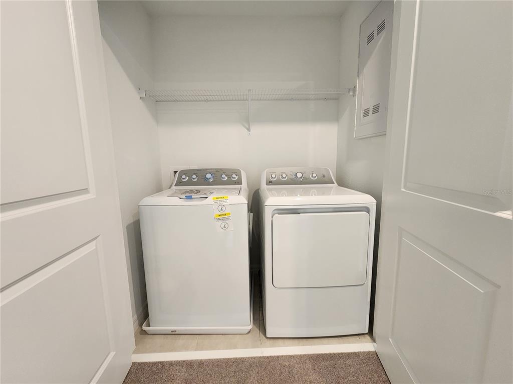 2620 Penguin Boulevard Davenport, FL 33837 - Photo 7 of 14 a utility room with dryer and washer