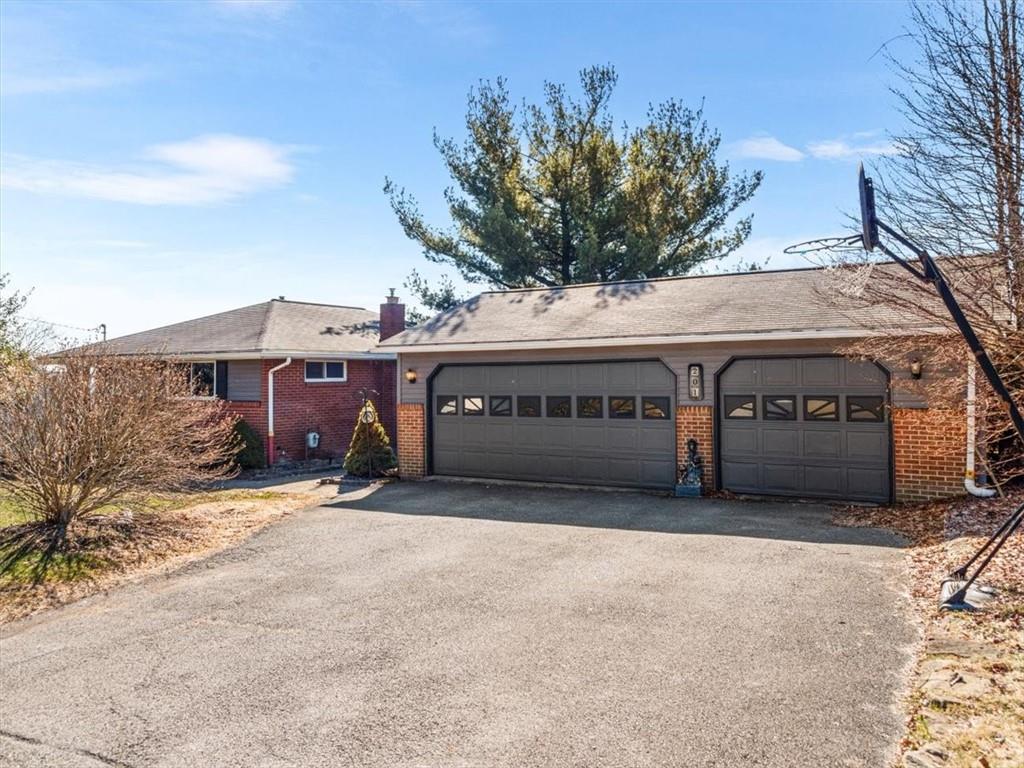 201 Western Avenue Beaver, PA 15009 - Photo 3 of 29 a view of a house with a yard and garage