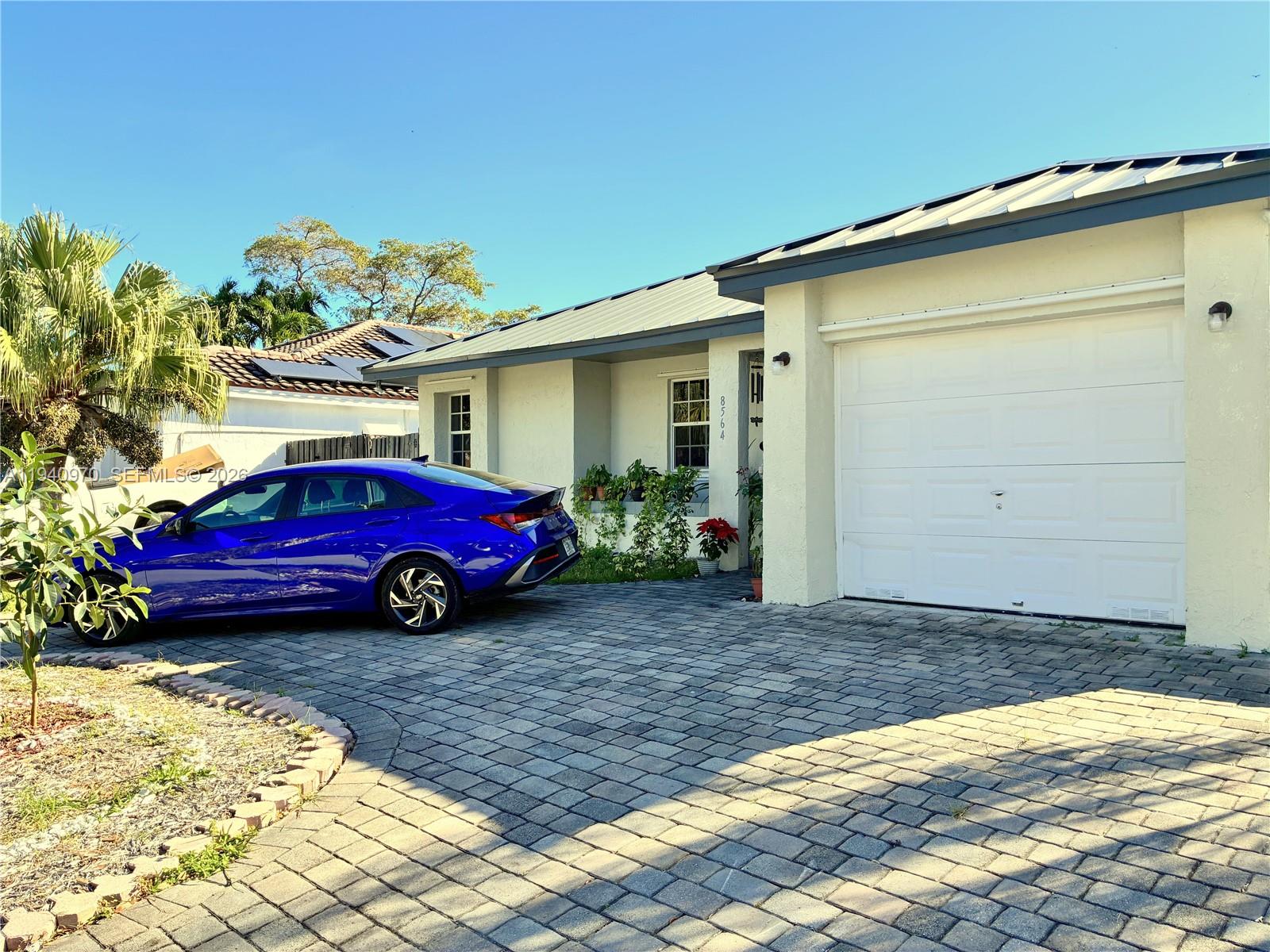 8564 Southwest 210th Terrace Cutler Bay, FL 33189 - Photo 2 of 18 a view of a house with a yard