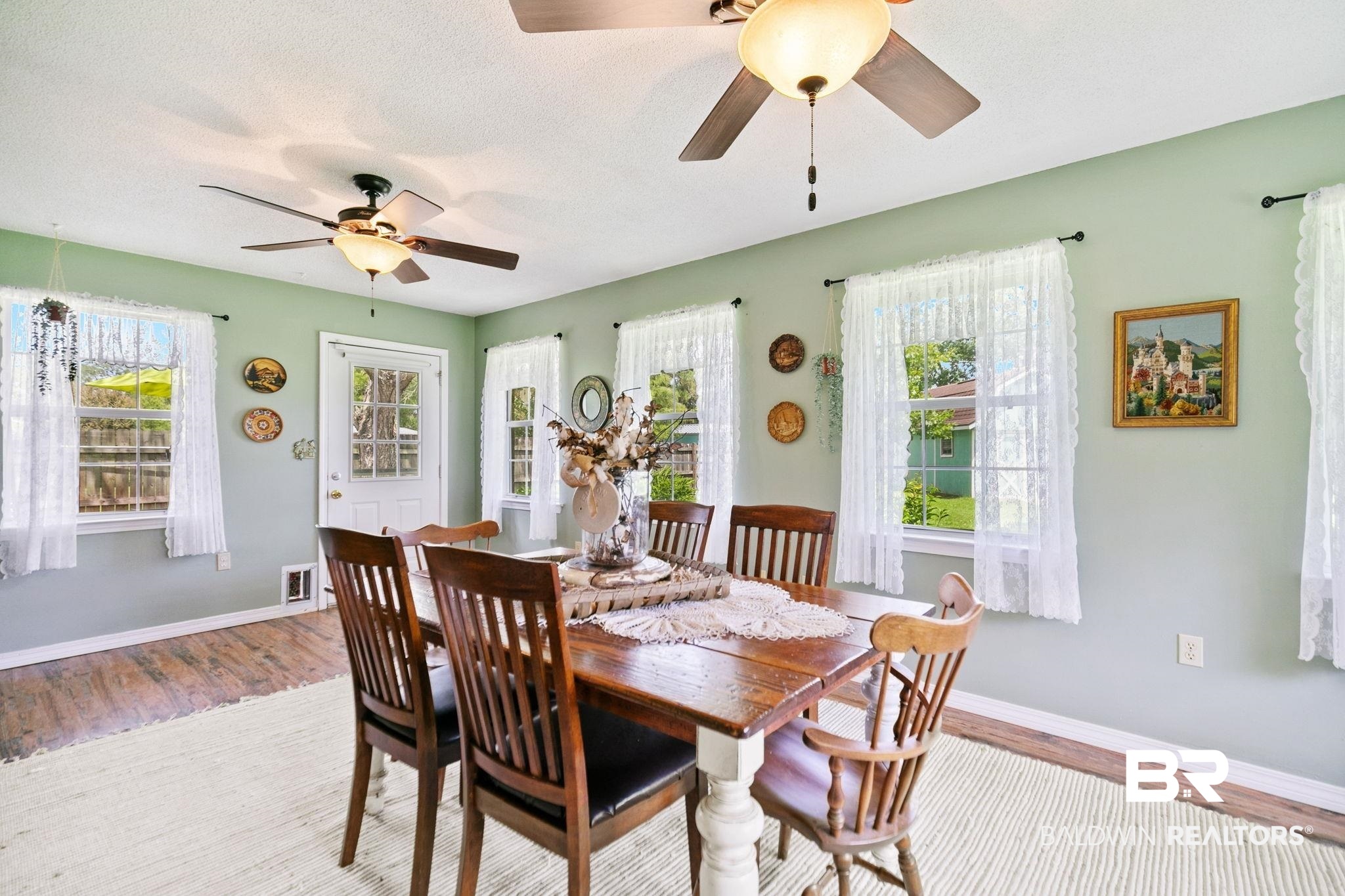53 Magnolia Circle Foley, AL 36535 - Photo 17 of 33 Dining area with ceiling fan, a textured ceiling, hardwood / wood-style floors, and plenty of natural light