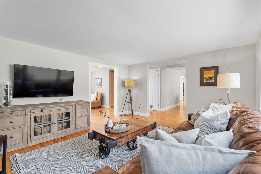 13 Mohegan Road Acton, MA 01720 - Photo 16 of 39 a living room with furniture and a flat screen tv