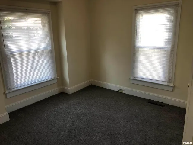 a bathroom with a sink vanity and a mirror