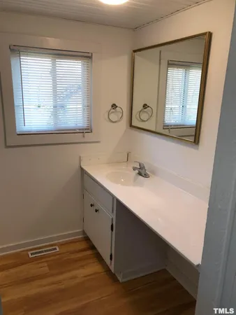 a white toilet sitting next to a bathtub