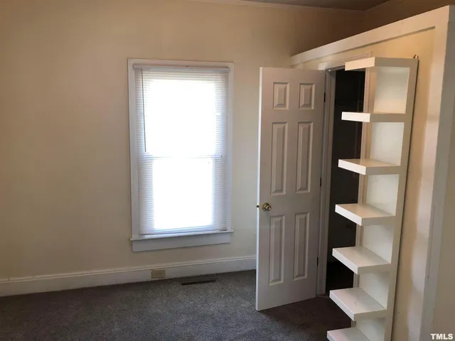 a view of an empty room and window