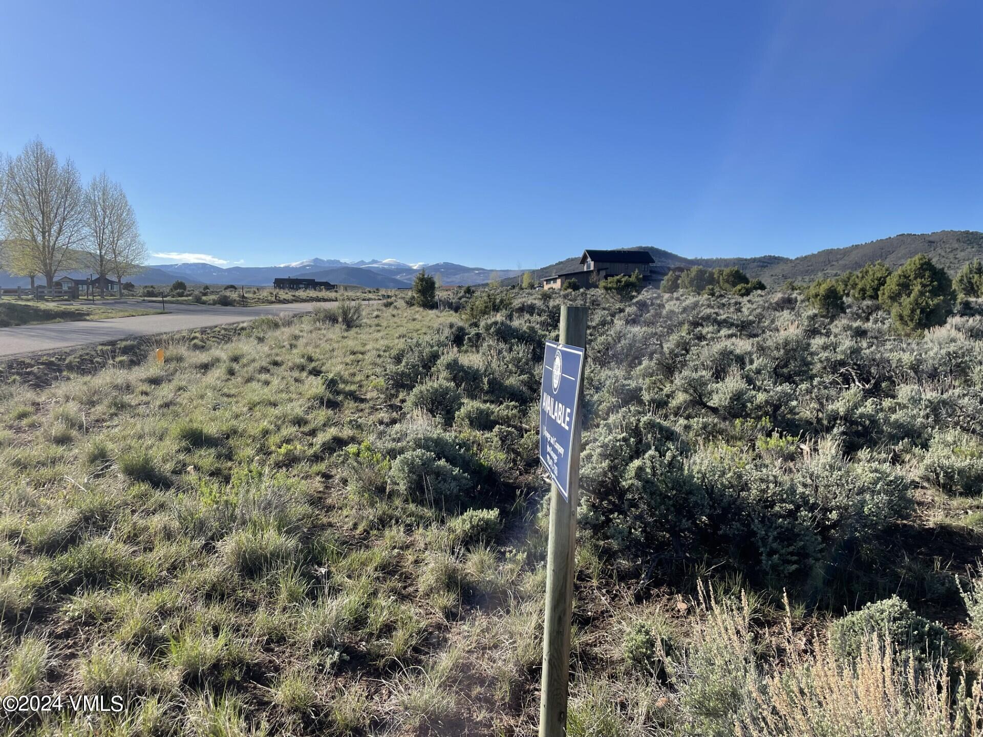 1446 East Haystacker Drive Eagle, CO 81631 - Photo 2 of 5 a view of a yard with a mountain