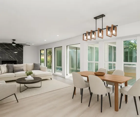 a view of a dining room with furniture window and outside view