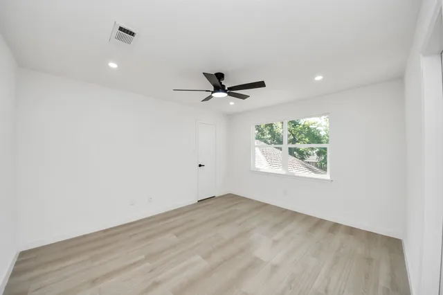 a bathroom with a sink vanity and a mirror