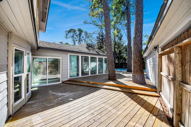 a view of a swimming pool with an outdoor seating