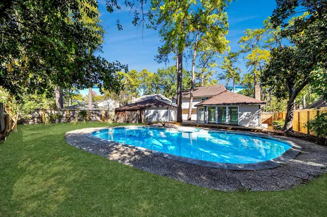a view of a park with large trees