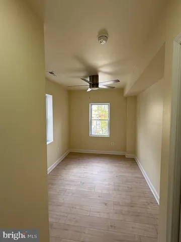 a view of an empty room and a window